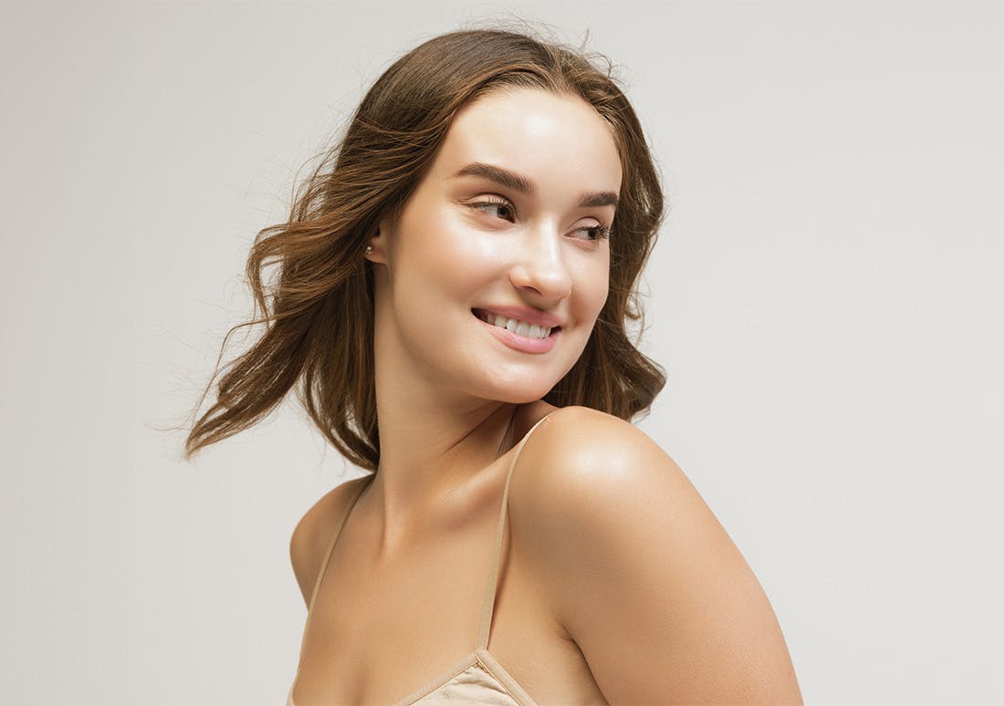 woman with shoulder length brown hair smiling